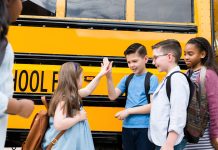 Children going back to school on a bus