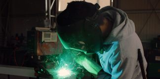 Welder in manufacturing facility