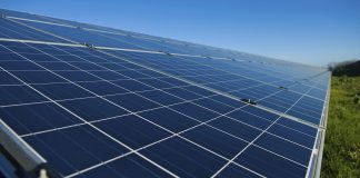 Row of solar panels on a solar farm