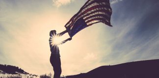 Man Flying American Flag