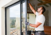 Worker installing a door