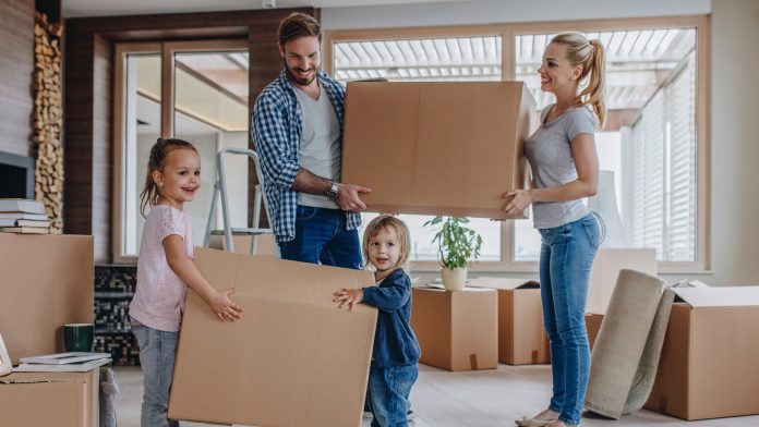 Young family moving into a new house Young family moving into a new house