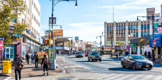 People crossing street in Fordham Heights center, New York City