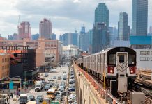 Subway Train Approaching Elevated Subway Station in Queens