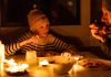 family eating by candlelight